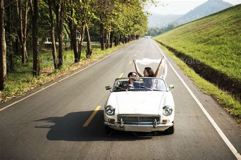 Couple Driving A Car Traveling On Road Trip Together Road Trip Photography Travel Photography