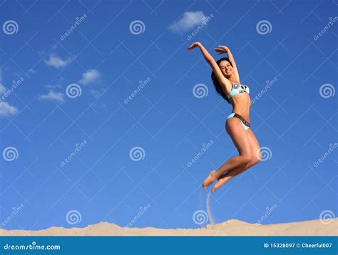 Jumping Happy Girl On The Beach Fit Sporty Healthy Body In Bikini Royalty Free Stock Image