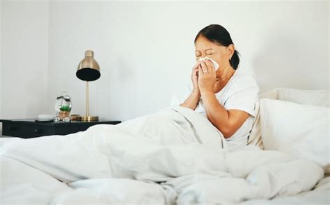 Premium Photo Senior Woman Blowing Nose And Sick In Bed With Allergy