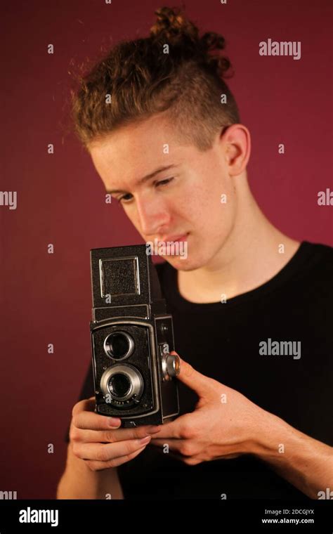 Young photographer with old, retro camera Stock Photo - Alamy