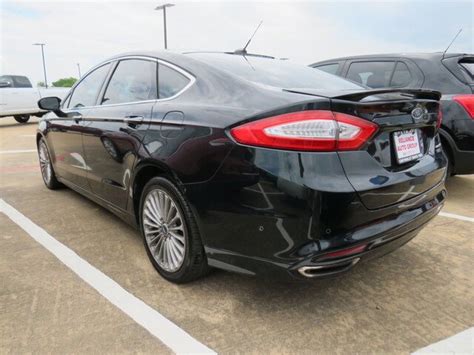 Pre Owned 2014 Ford Fusion Titanium Sedan 4 Dr In Bay City 9941a Reliance Chevrolet Gmc