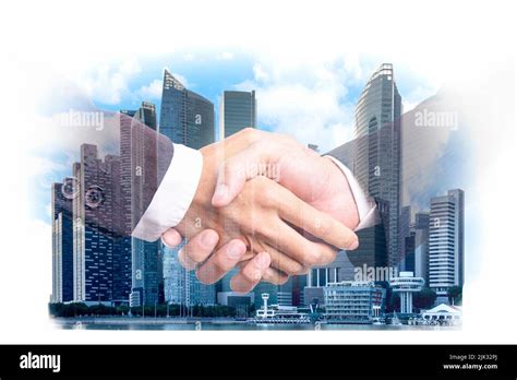 Double Exposure Businessman Handshake On Modern City Building Financial