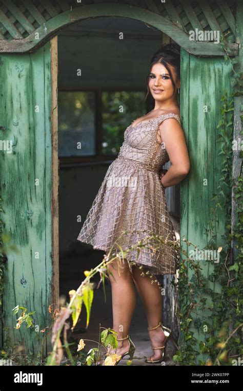 Beautiful Teen Brunette Girl In A Golden Dress Ready For Prom Stock