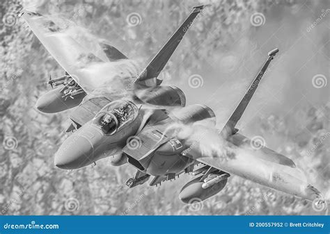 Powerful Military F15 Fighter Jet In A High G Force Turn Stock Photo