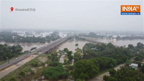 Overflowing Thamirabarani river breaches nearby areas in Tirunelveli ...