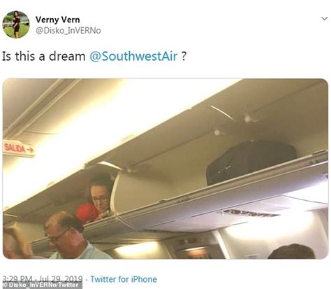 Southwest Airlines Flight Attendant Climbs Into Overhead Compartment