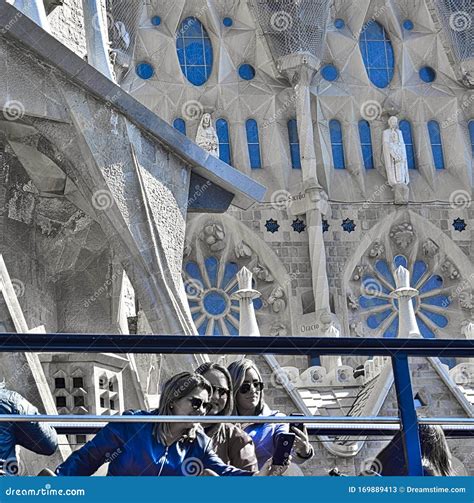 A Group Of Beautiful Tourists Taking Selfies With The Sagrada Familia