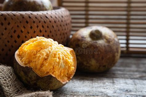 Exotic Indian Bel Fruit or Wooden Apple. Bel Fruit Slices on Wooden Rustic Background. Natural ...