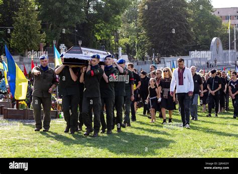 The coffin is carried during the funeral of a serviceman, killed by the ...