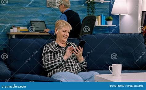 Happy Middle Aged Mature Woman Enjoying Using Mobile Apps Texting Stock