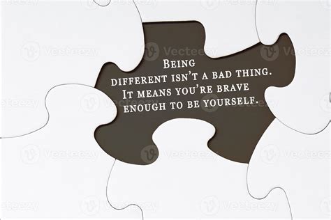 Motivational quote on white jigsaw puzzle with some missing pieces