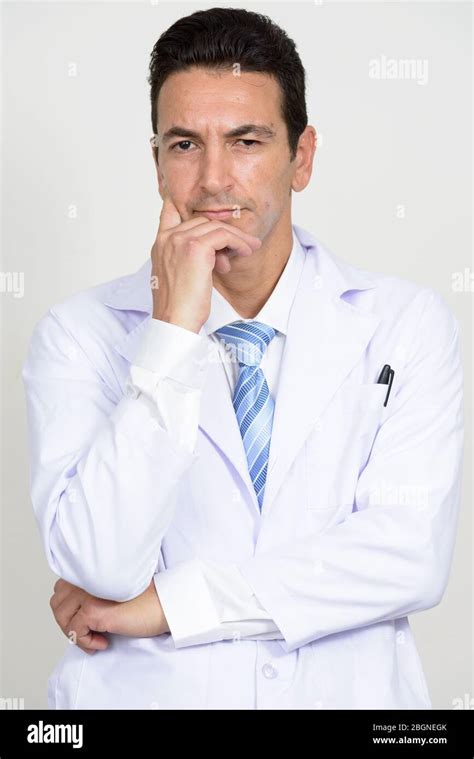 Portrait Of Mature Handsome Man Doctor Thinking Stock Photo Alamy