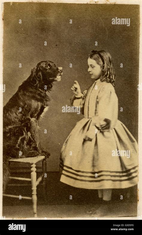 Victorian Girl Training Her Dog Stock Photo Alamy