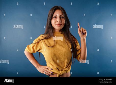 Beautiful Brunette Woman Wearing Isolated Over Blue Background Shaking