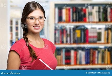 Portrait Of A Student In A Library Stock Image Image Of Eyeglasses