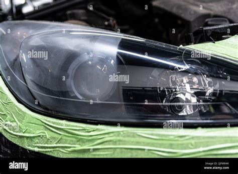 Effect before and after. Polishing of car headlights Stock Photo - Alamy