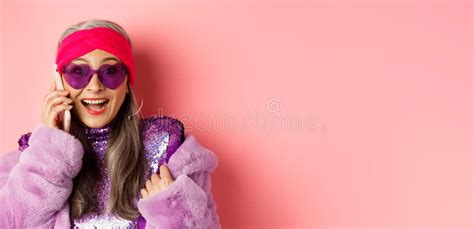 Fashion Close Up Of Stylish Asian Senior Woman Hear Amazing News On