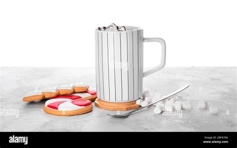 Cup Of Hot Chocolate Cookies And Marshmallows Table Against White