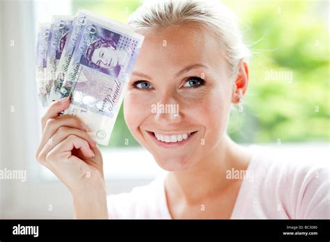 Woman Holding 20 Pound Notes Stock Photo Alamy