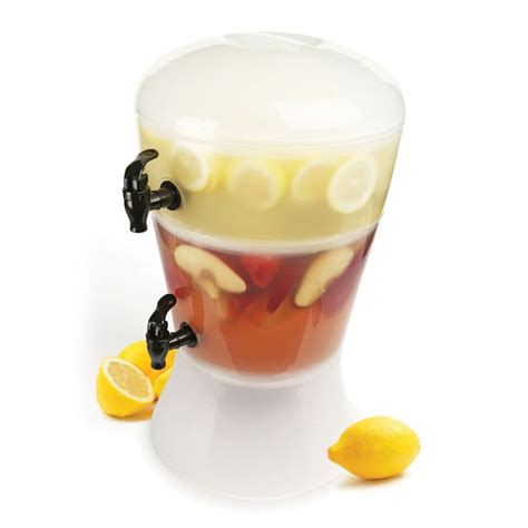 A Cup Filled With Liquid And Lemon Slices