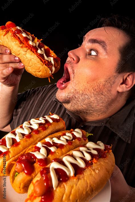 Fat Man Eating Chili Dogs