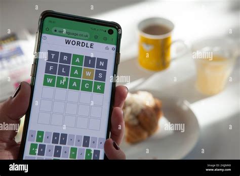 A Wordle Player Does The Daily Word Puzzle Over Breakfast The Game