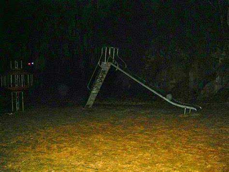 scary playground at night cursed image