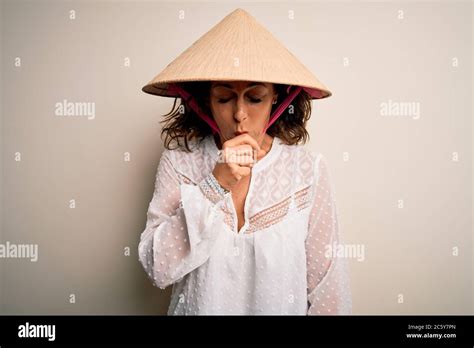 Middle Age Brunette Woman Wearing Asian Traditional Conical Hat Over