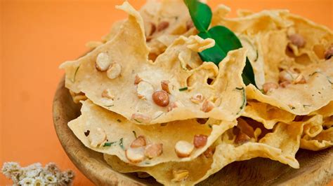 Rempeyek Or Peyek With Cashew Nuts And Coriander On Orange Background