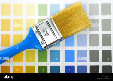 paintbrush on color palette Stock Photo - Alamy