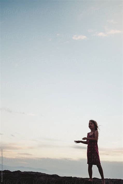 Young Girl Standing In Wind On The Beach At Sunset By Stocksy Contributor Rob And Julia