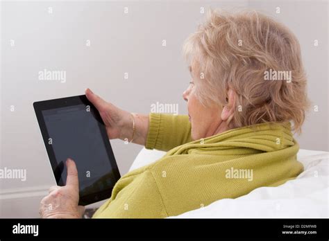 Mature Lady Using A Digital Tablet Stock Photo Alamy