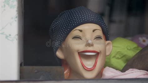 Head Of Mannequin In Store Window As Laughing Woman With Her Mouth Wide