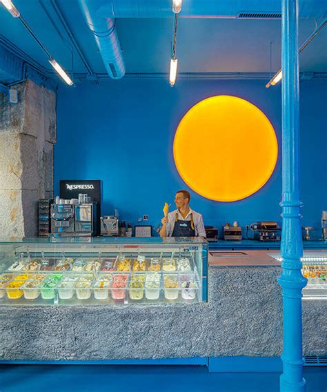 Circular Sun Lamp Illuminates Blue Brando Ice Cream Shop In Madrid