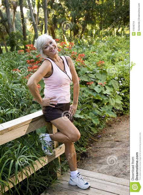 Woman In Workout Clothes Standing On Park Bridge Workout Clothes How