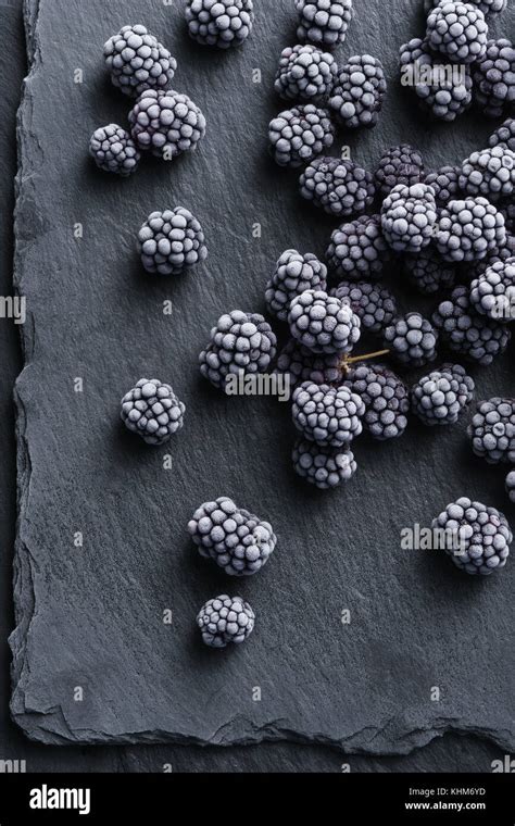 Frozen Blackberry On Black Slate Top View High Resolution Product