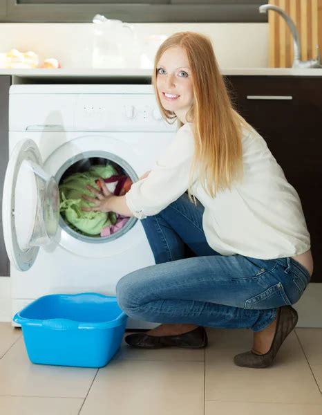 Long Haired Woman Using Washing Machine At Home Stock Image Everypixel