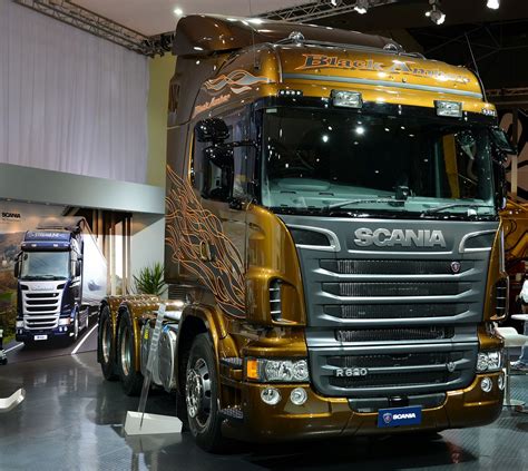 A Large Semi Truck On Display In A Showroom