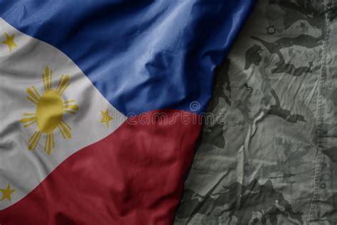 Waving Flag of Philippines on the Old Khaki Texture Background ...