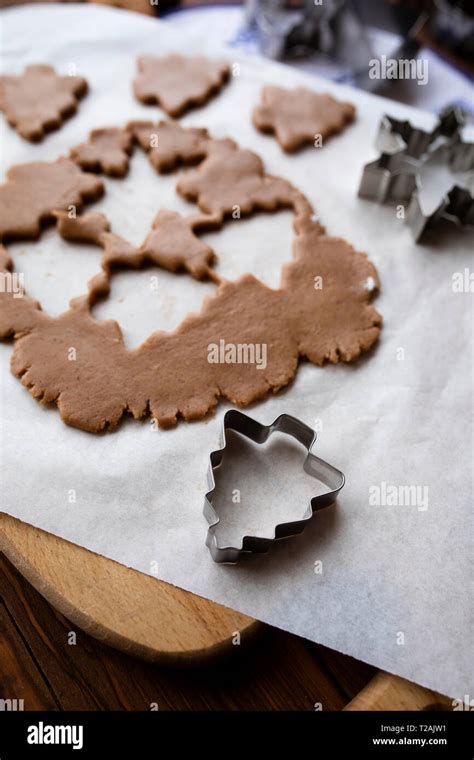 Cookie dough with cut out shapes Stock Photo - Alamy