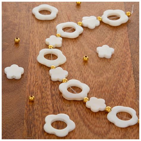 White Flower Cutout Shell Bead Strand Hobby Lobby 2273555