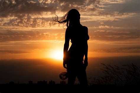 Girl silhouette on sunset background | Sunset background, Girl ...