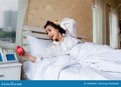 Young Beautiful Woman Wake Up Too Late In Bedroom Stock Image Image