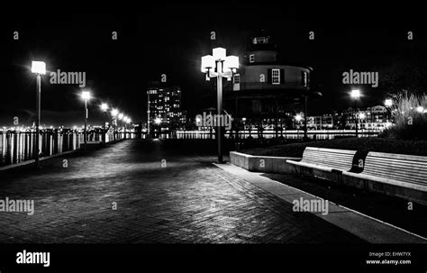 Waterfront Promenade And Lighthouse At Night In The Inner Harbor