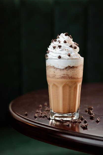 Premium Photo A Glass Of Iced Coffee With Whipped Cream And Chocolate