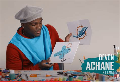 rookie rb devon achane painting dolphin logo  memory rmiamidolphins