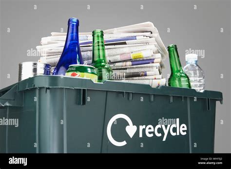 Recycling Bin Filled With Waste Paper And Bottles Close Up Stock Photo