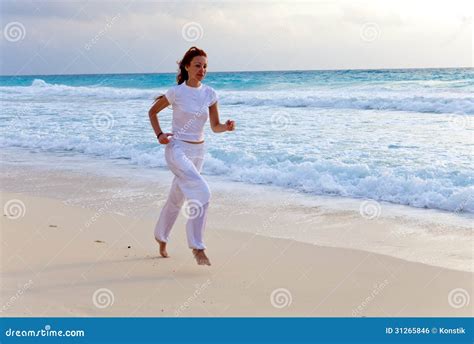 Woman Runs Along Sea Coast Portrait To The Utmost Stock Photo Image