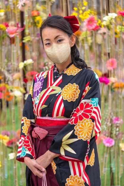 Premium Photo | Japanese woman wearing a face mask in hakama kimono in ...