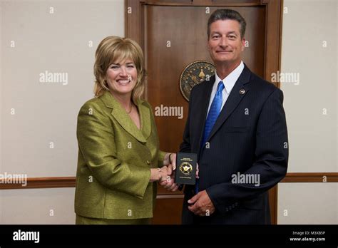 US Marshals Service Director Stacia Hylton swears in David L. McNulty ...